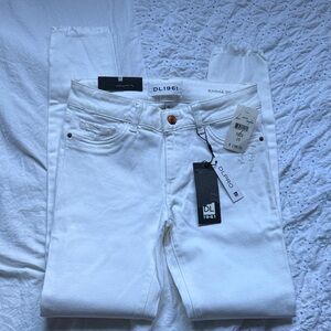 DL1961 White Skinny Jeans with frayed hem.